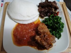 plate of yummy sadza and an assortment of relish