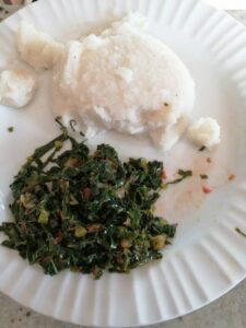 sadza and green vegetables on  a plate