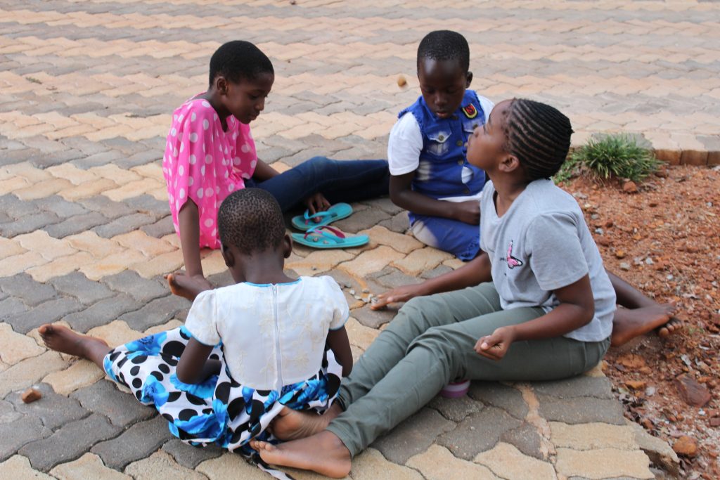 Children playing 'nhodo'